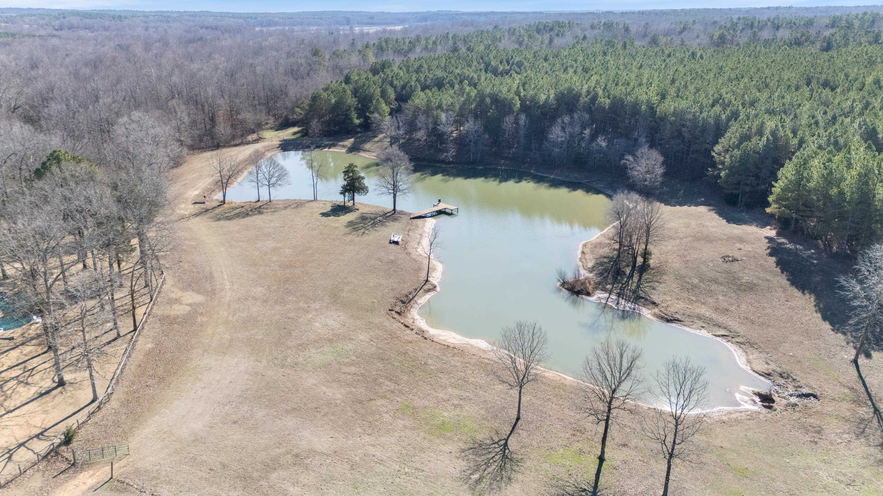 891 Musgray Road Holly Springs, MS 38635 - Photo 34 of 38 a view of a swimming pool with a yard