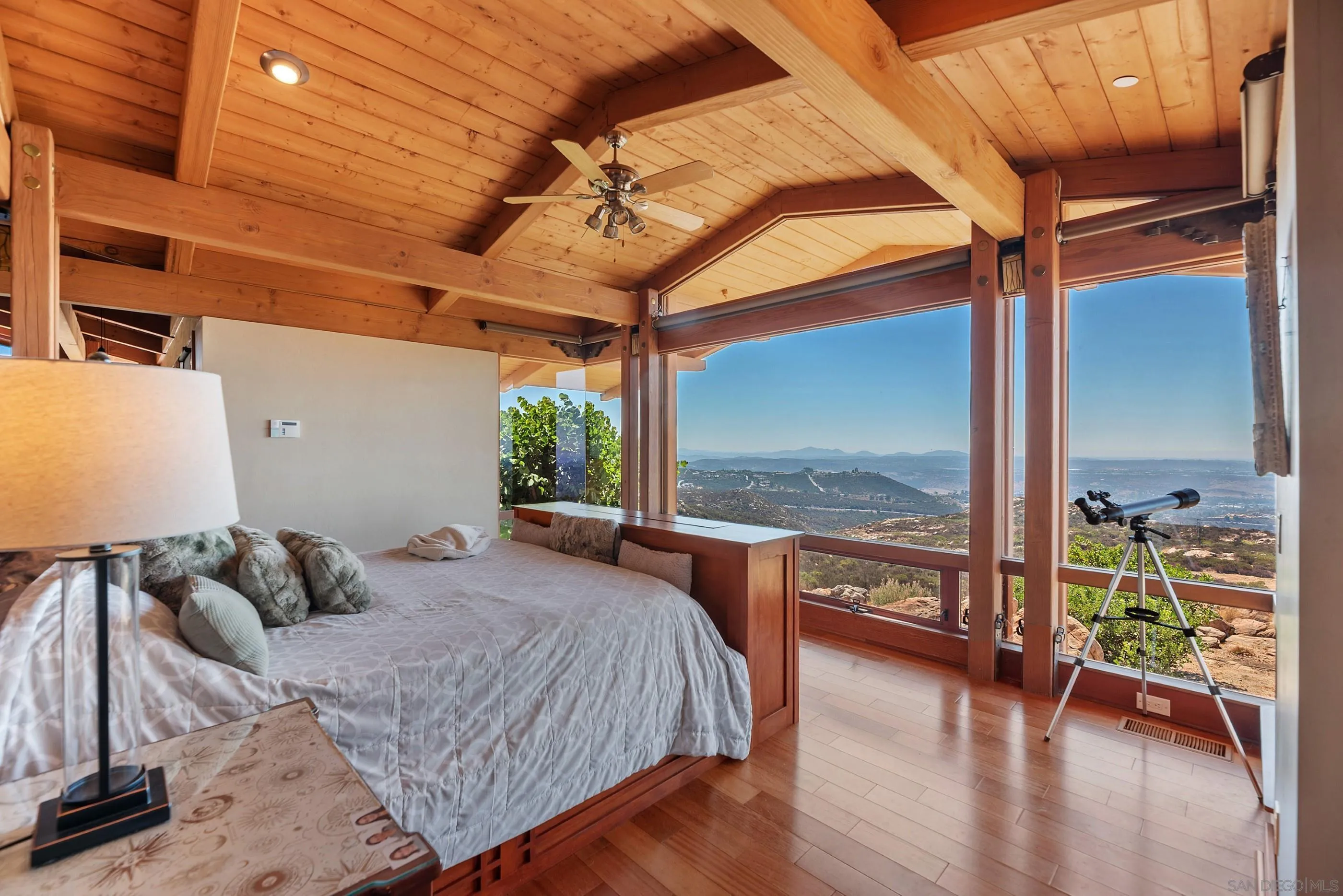 15535 Westview Road Poway, CA 92064 - Photo 55 of 74 a bedroom with a bed and wooden floor