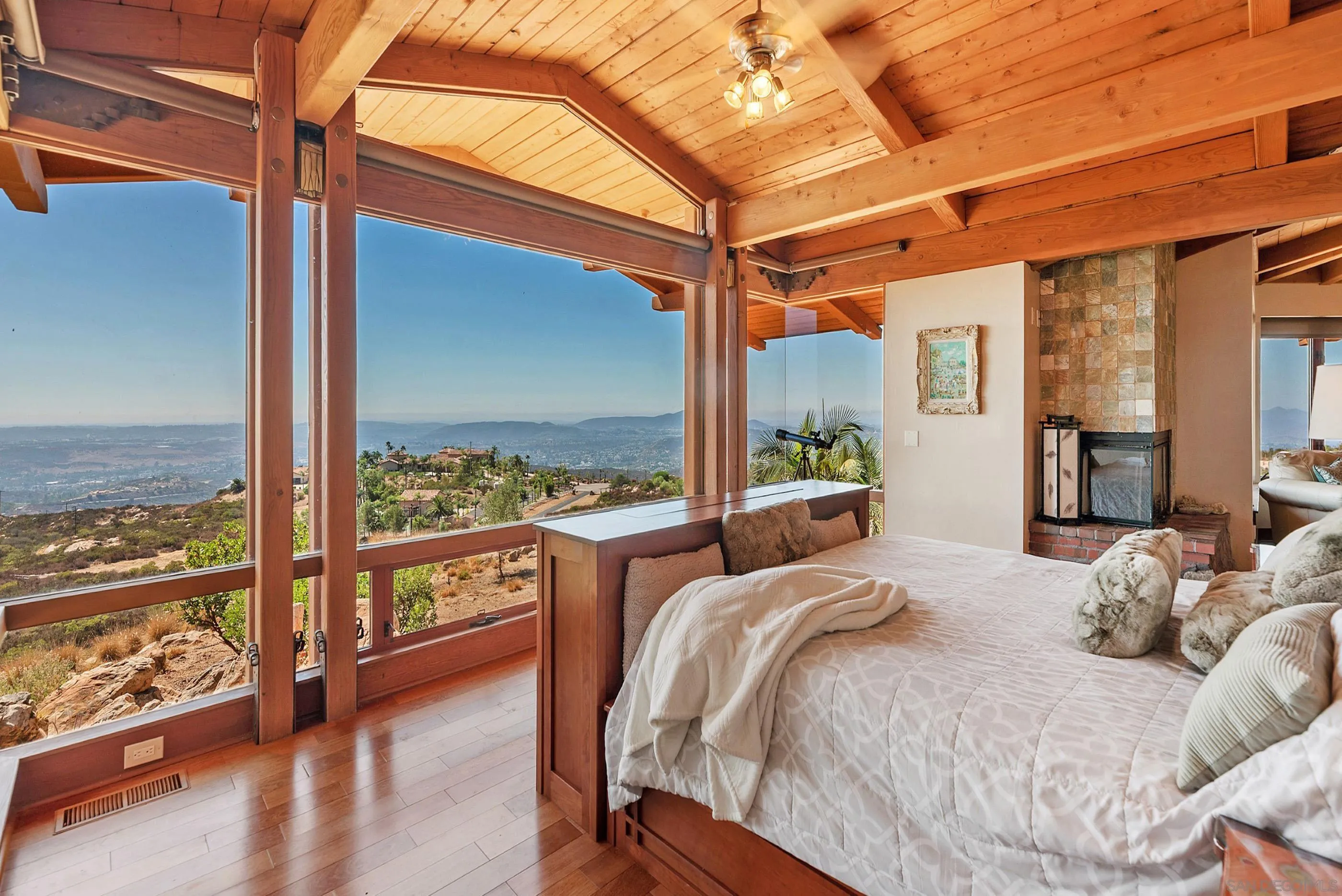 15535 Westview Road Poway, CA 92064 - Photo 56 of 74 a bedroom with a large bed and a balcony view