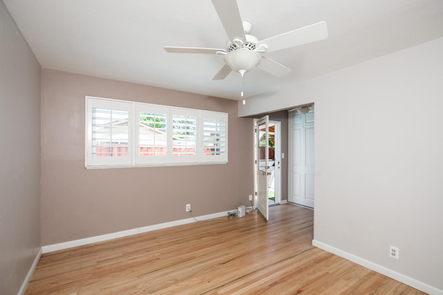 1937 Adelaide Way San Jose, CA 95124 - Photo 16 of 33 an empty room with wooden floor fan and windows