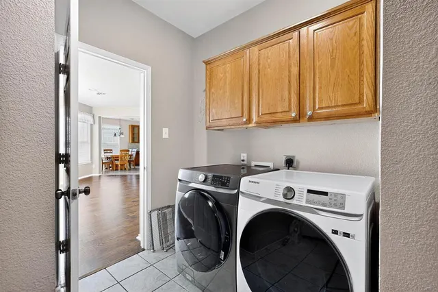 a view of storage and utility room with washer and dryer