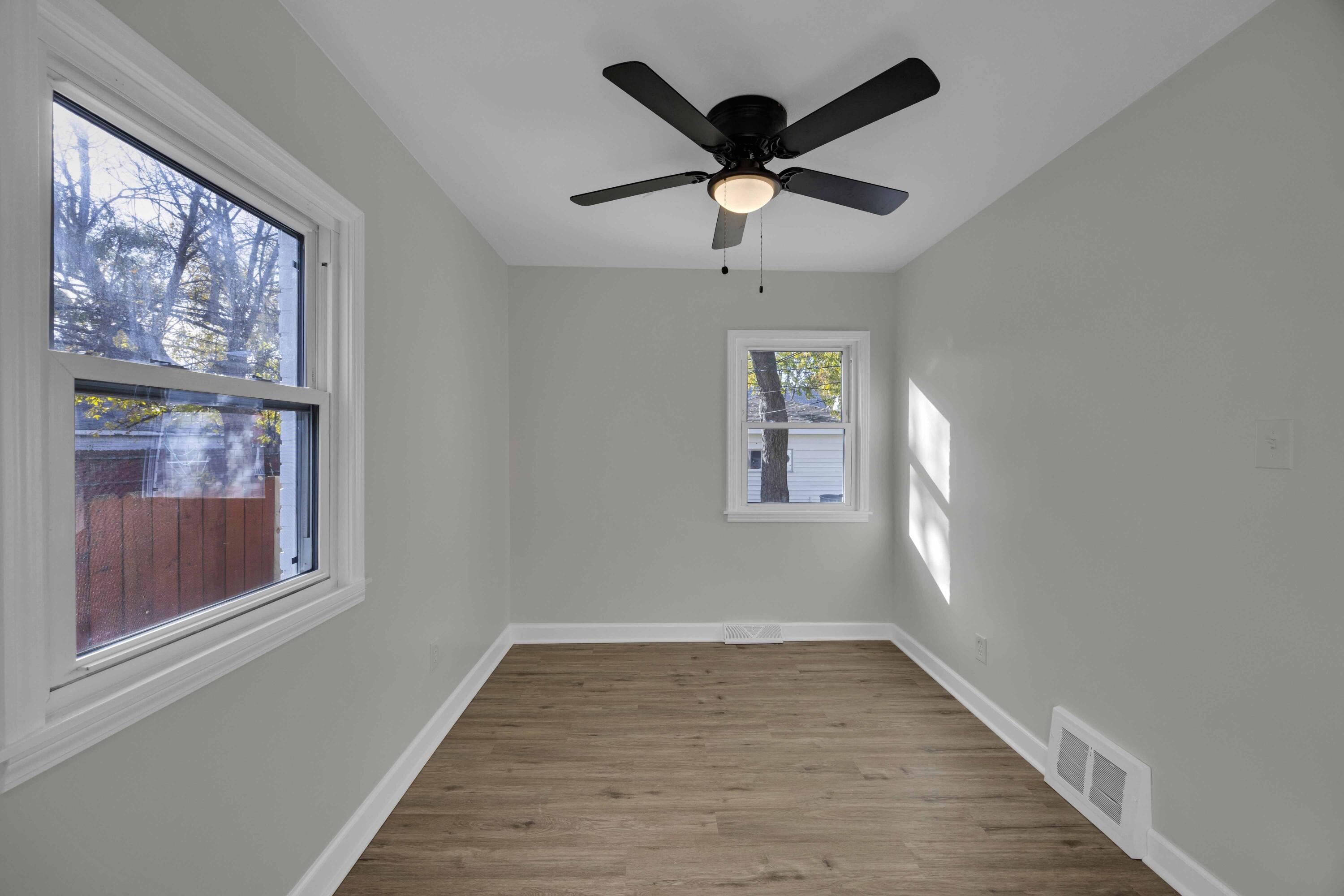 5428 Chestnut Avenue Hammond, IN 46320 - Photo 12 of 20 wooden floor in an empty room with a window