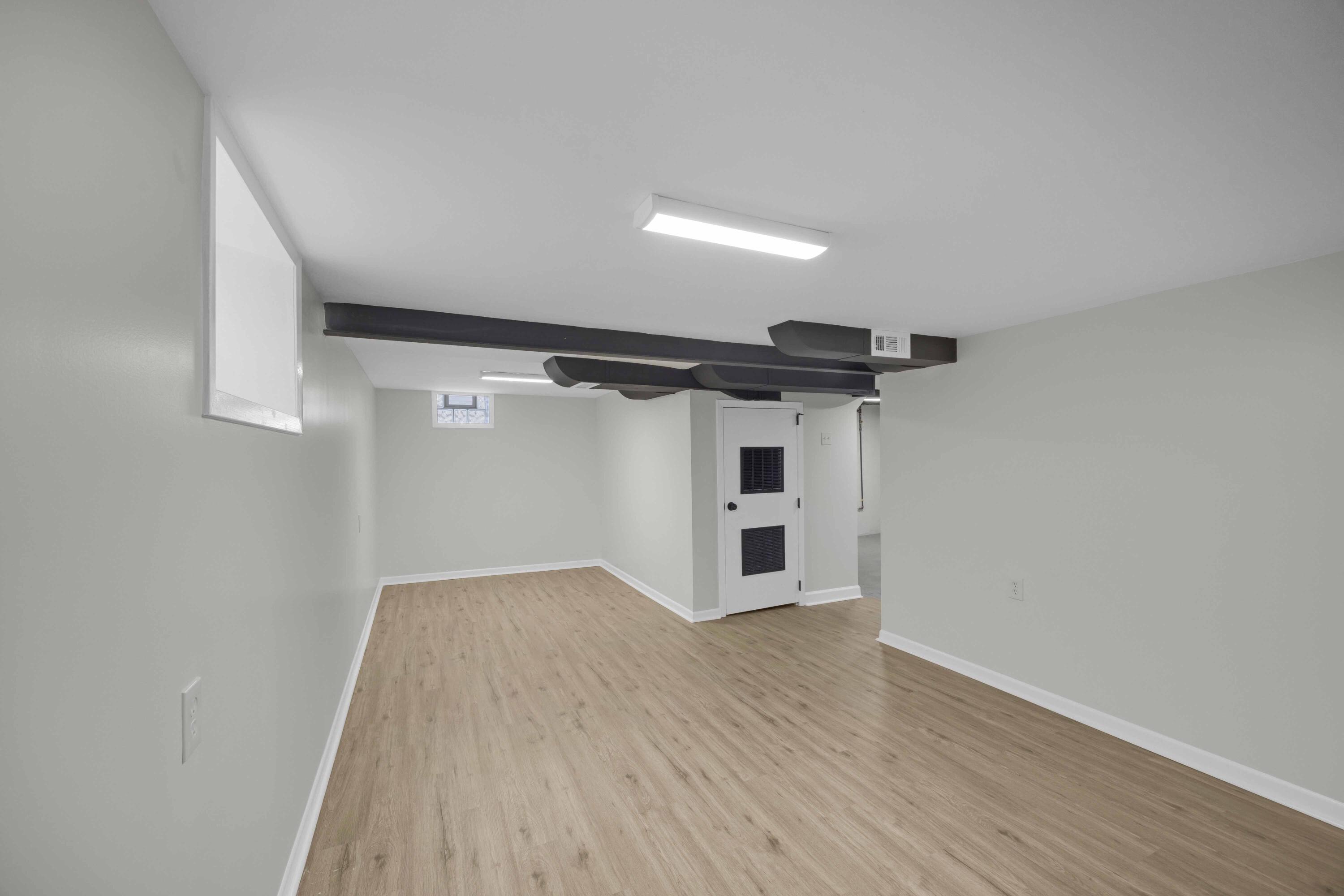 5428 Chestnut Avenue Hammond, IN 46320 - Photo 15 of 20 a view of an empty room with wooden floor