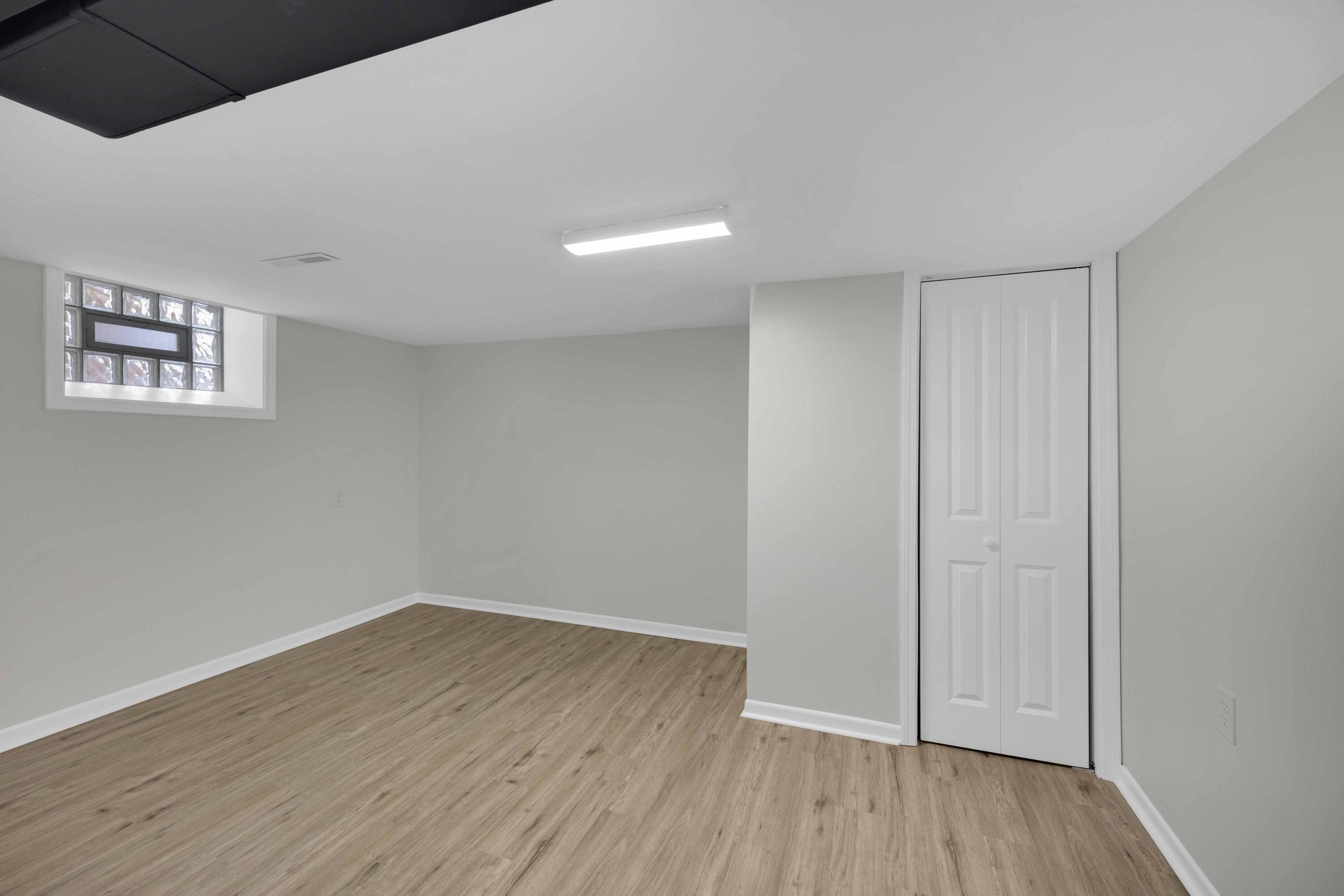 5428 Chestnut Avenue Hammond, IN 46320 - Photo 16 of 20 a view of an empty room with wooden floor