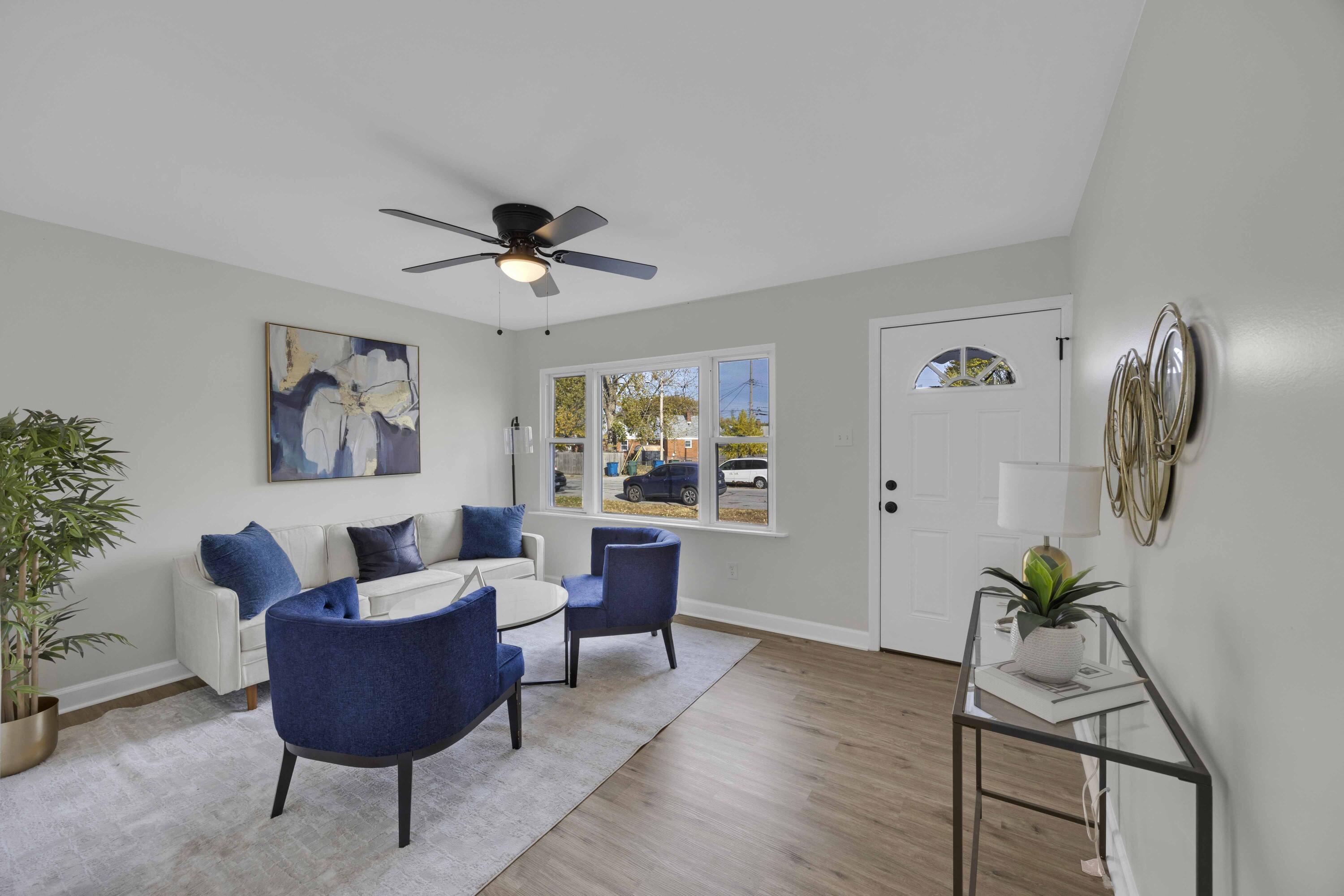 5428 Chestnut Avenue Hammond, IN 46320 - Photo 2 of 20 a living room with furniture and a potted plant
