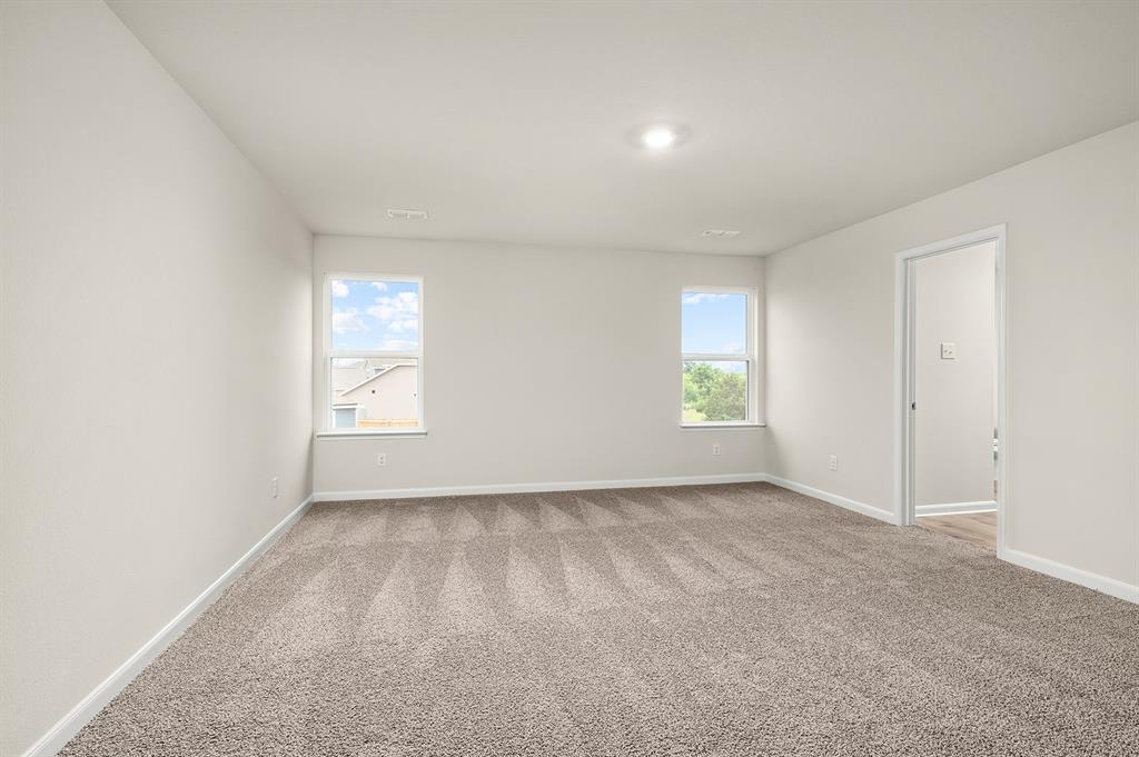 1208 Reed Street Greenville, TX 75401 - Photo 4 of 5 an empty room with windows