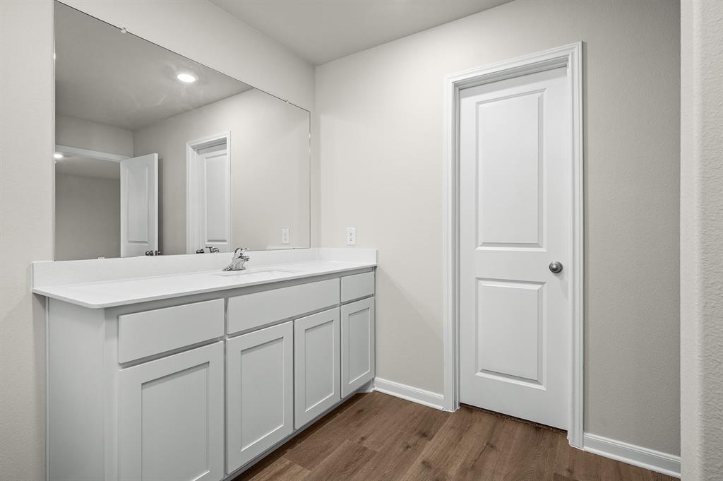 1208 Reed Street Greenville, TX 75401 - Photo 5 of 5 a bathroom with a sink and a mirror