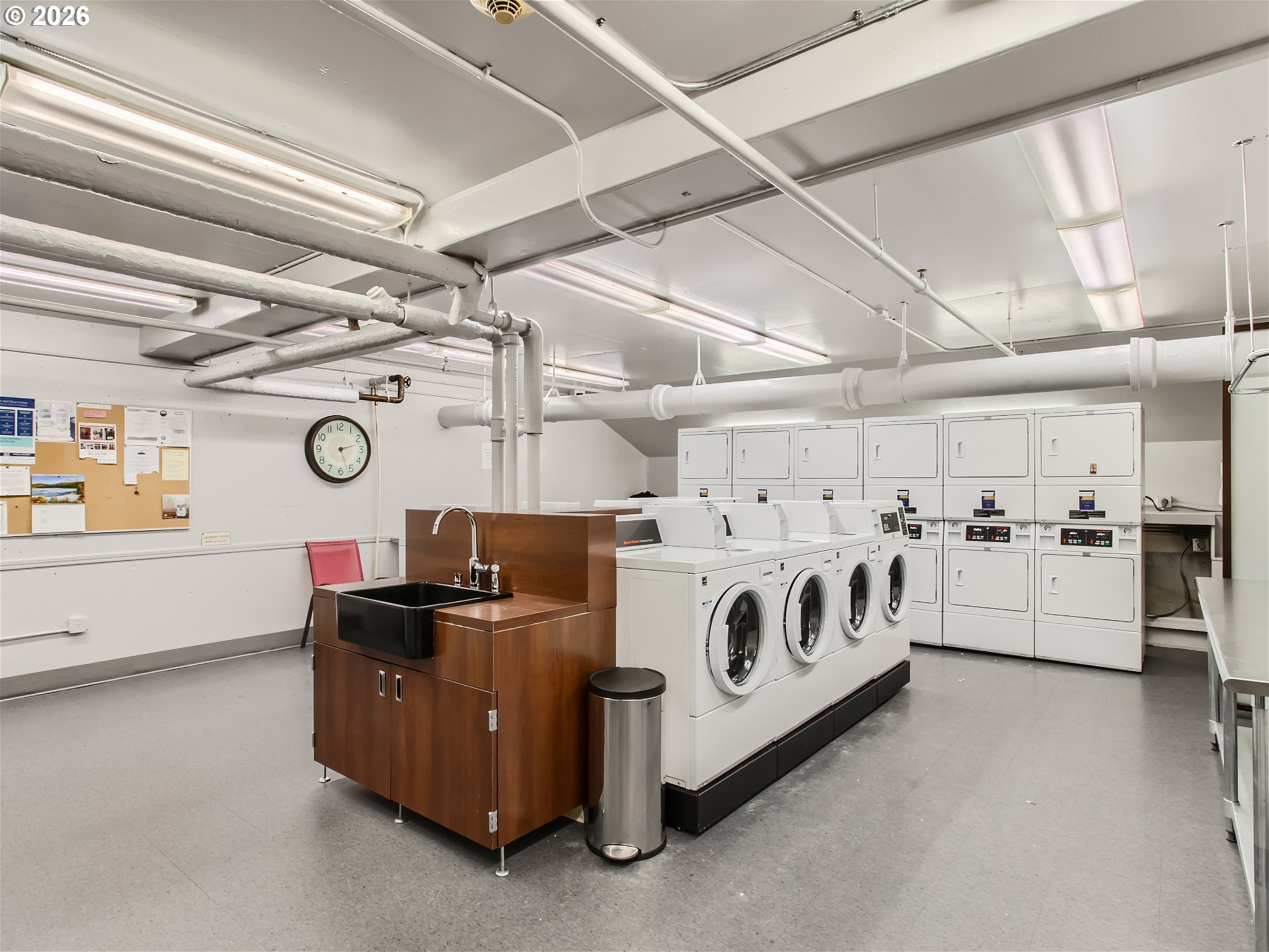 111 Southwest Harrison Street, Unit 4G Portland, OR 97201 - Photo 11 of 13 a utility room with lots of wooden furniture