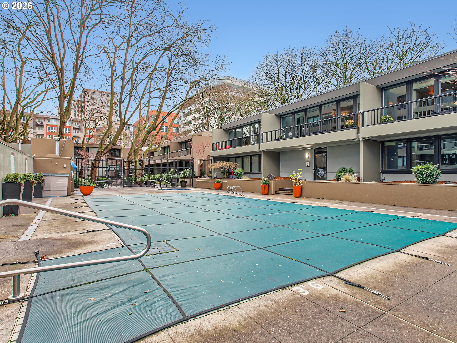 111 Southwest Harrison Street, Unit 4G Portland, OR 97201 - Photo 12 of 13 a view of outdoor space with lots of palm trees