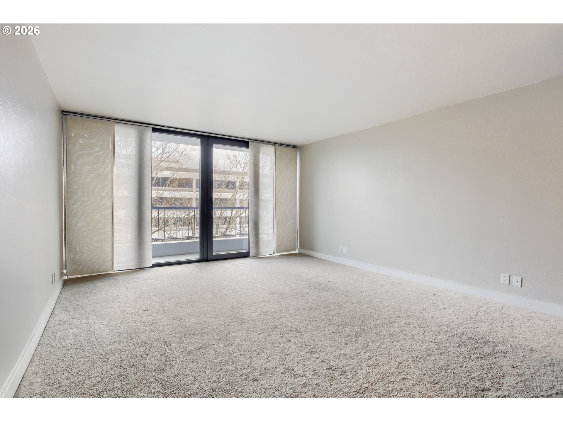 111 Southwest Harrison Street, Unit 4G Portland, OR 97201 - Photo 4 of 13 a view of an empty room with a window