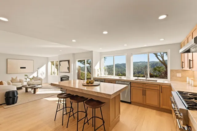 a kitchen with a sink and large window