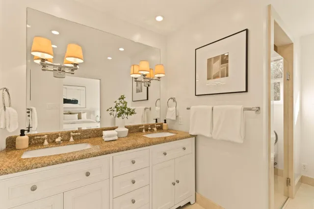 a bedroom with a bed and lamp