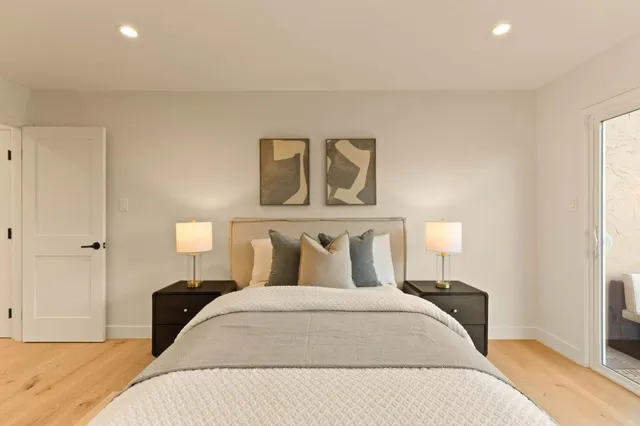 a bedroom with a bed and a desk