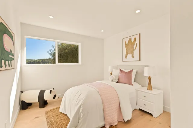 a bathroom with a sink vanity mirror and toilet