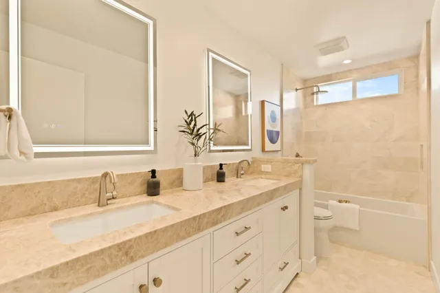 a view of a yard with wooden fence