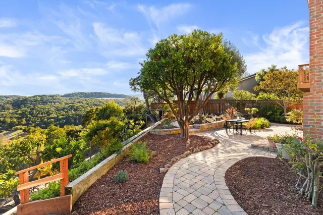 a view of swimming pool with a patio and mountain view