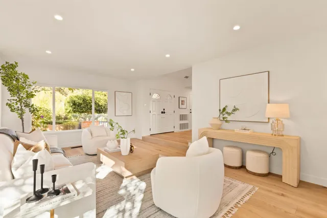 a dining room with furniture and wooden floor