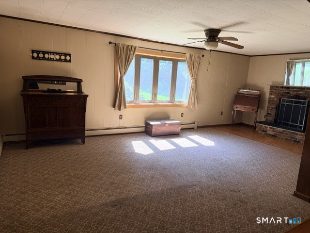 528 Norwich Road Plainfield, CT 06374 - Photo 10 of 25 Living room with fireplace and sitting area with built in shelving