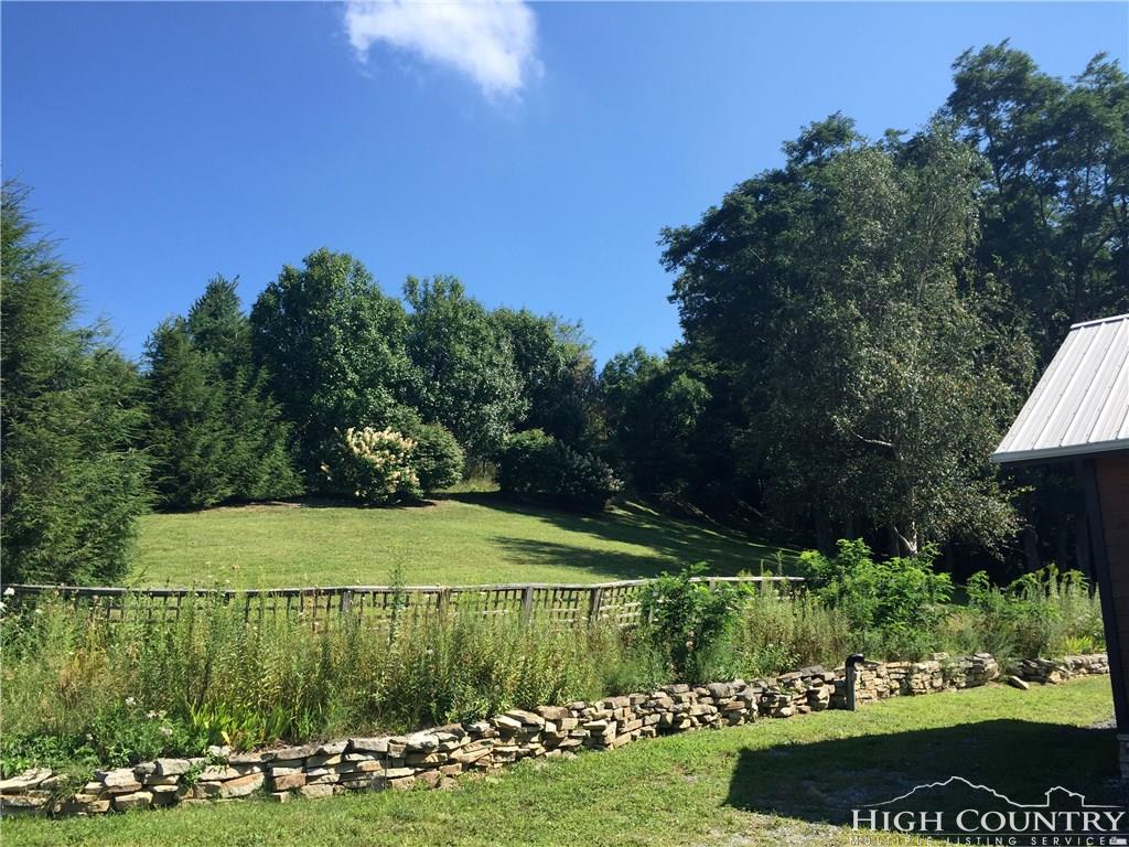 1071 Elk Hill Road Banner Elk, NC 28604 - Photo 11 of 28 a view of a golf course with a garden