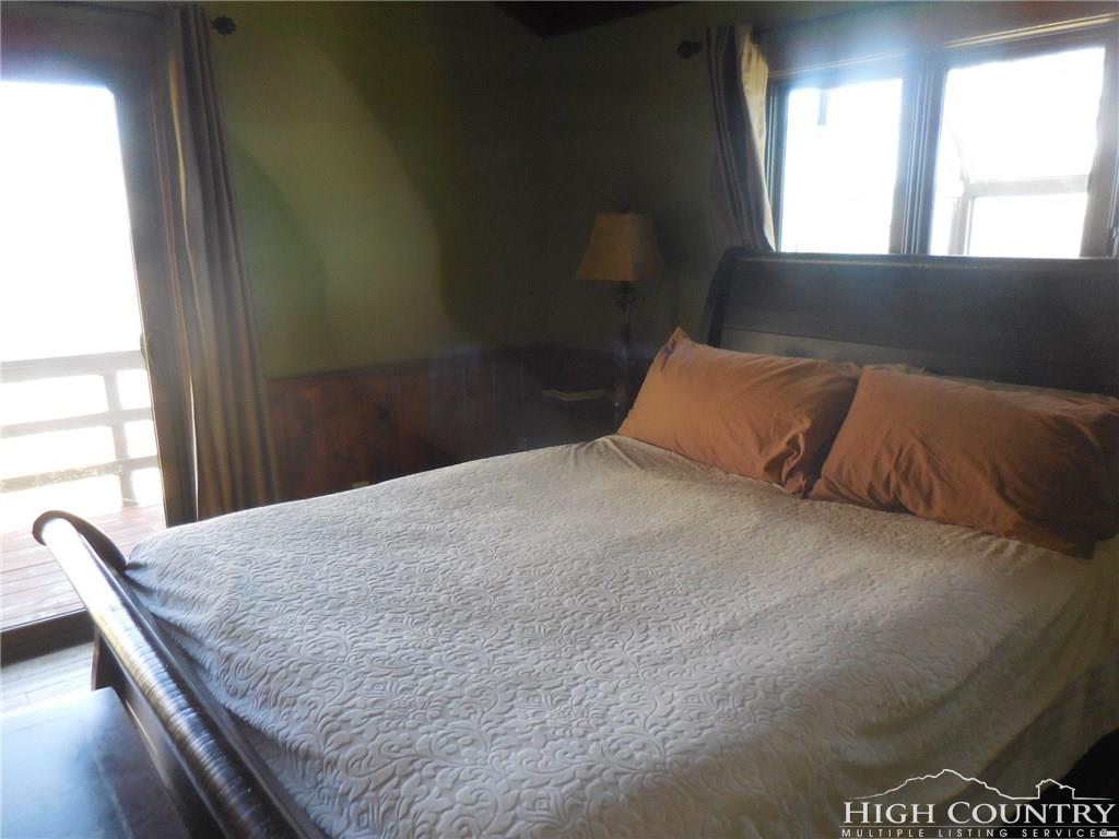 1071 Elk Hill Road Banner Elk, NC 28604 - Photo 15 of 28 a bedroom with a bed and window