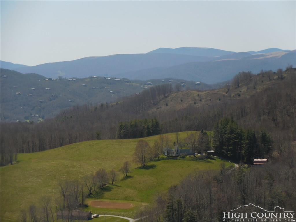 1071 Elk Hill Road Banner Elk, NC 28604 - Photo 18 of 28 a view of a lake with a mountain