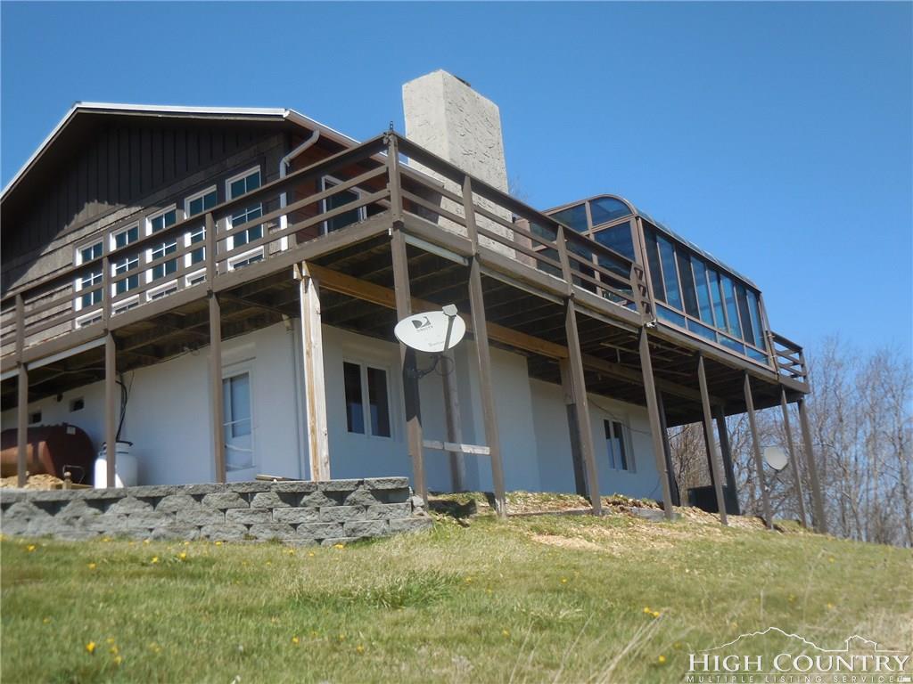 1071 Elk Hill Road Banner Elk, NC 28604 - Photo 2 of 28 a view of a house with a wooden fence