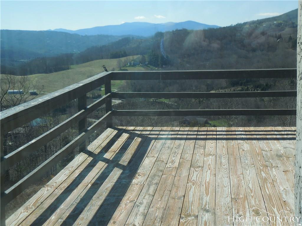 1071 Elk Hill Road Banner Elk, NC 28604 - Photo 22 of 28 a view of backyard with wooden floor and mountain view