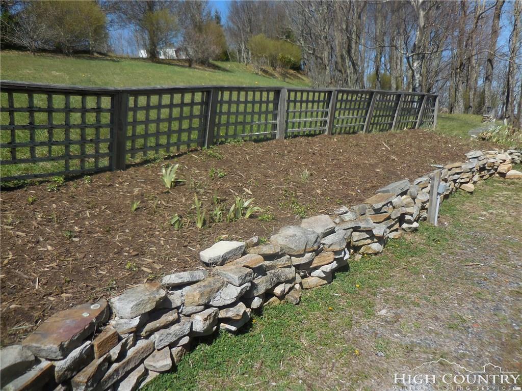 1071 Elk Hill Road Banner Elk, NC 28604 - Photo 27 of 28 a view of a yard with wooden fence