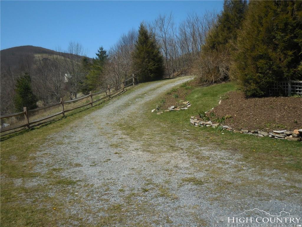 1071 Elk Hill Road Banner Elk, NC 28604 - Photo 28 of 28 a view of a yard with mountain view
