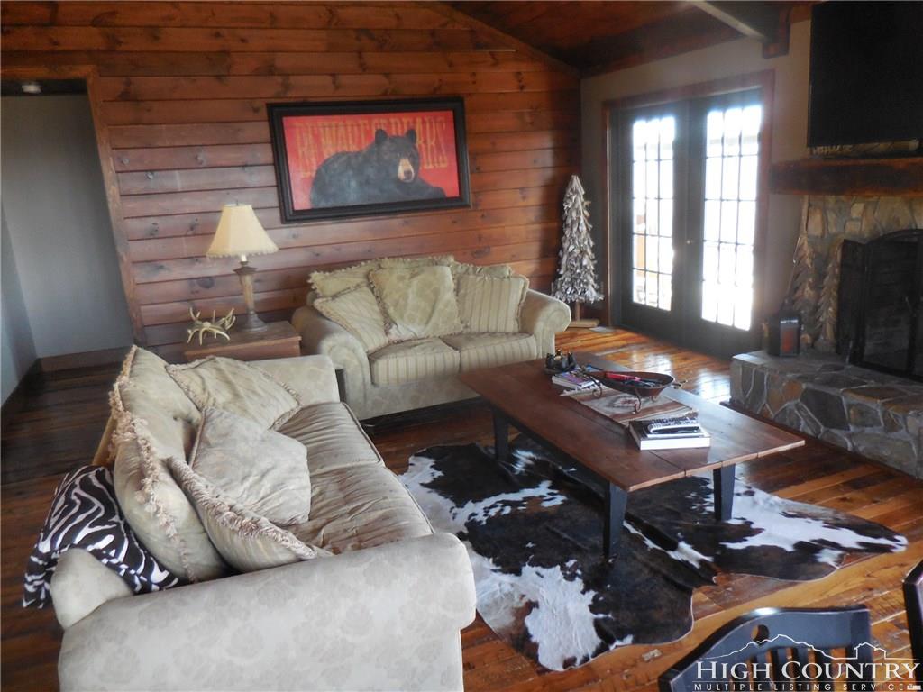 1071 Elk Hill Road Banner Elk, NC 28604 - Photo 6 of 28 a living room with furniture and a fireplace