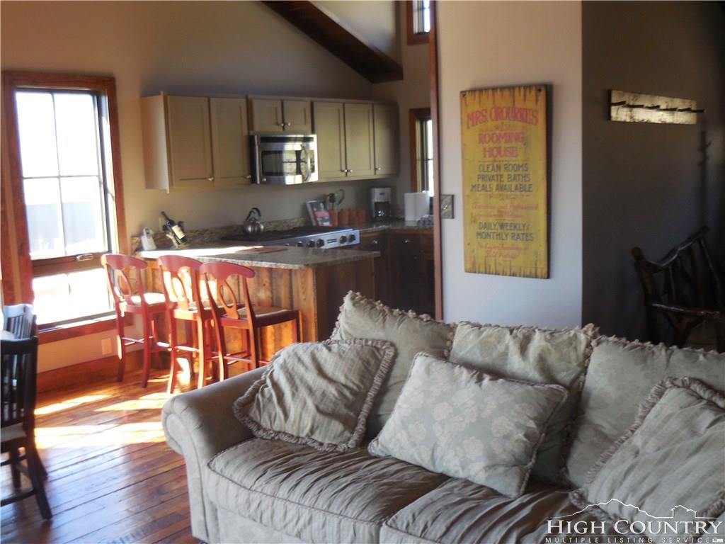 1071 Elk Hill Road Banner Elk, NC 28604 - Photo 7 of 28 a living room with furniture and a flat screen tv