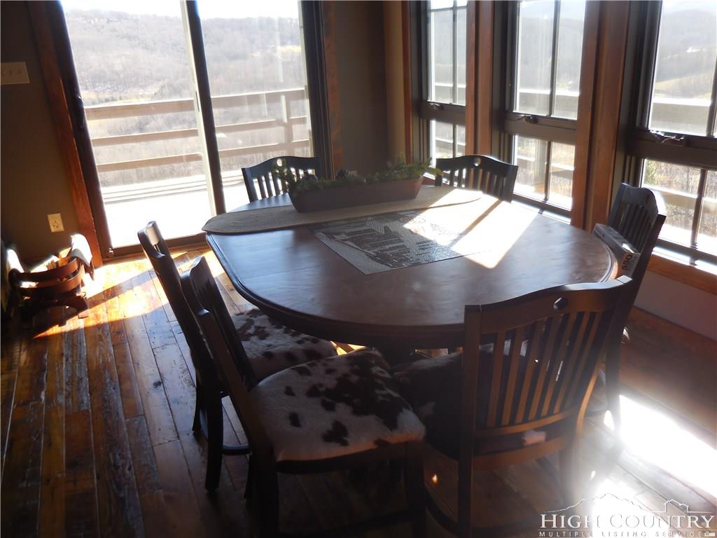1071 Elk Hill Road Banner Elk, NC 28604 - Photo 9 of 28 a view of a dining room with furniture and a window