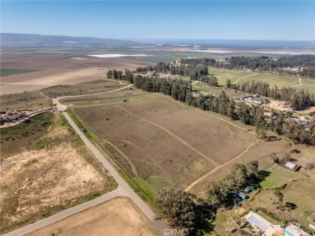 a view of a yard with an ocean view