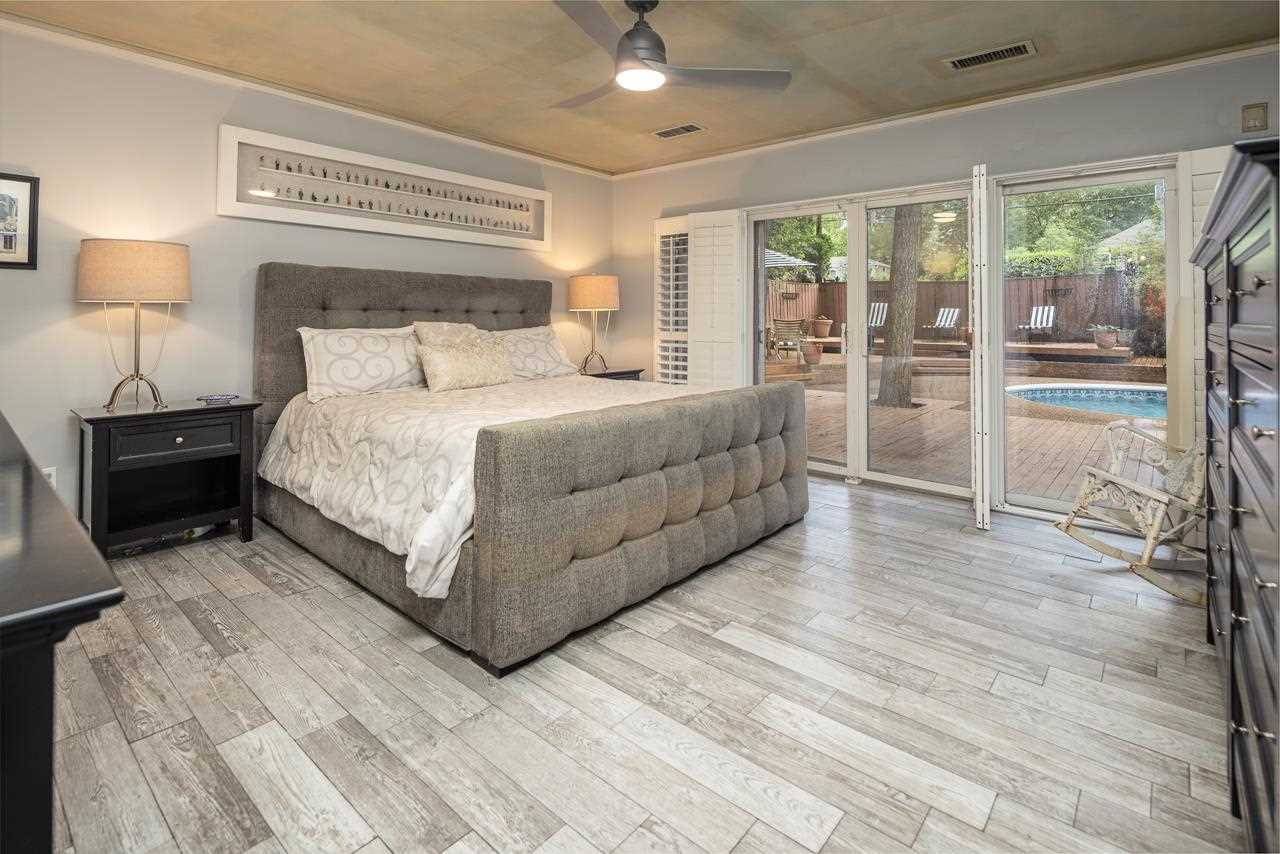 4411 Walnut Grove Road Memphis, TN 38117 - Photo 11 of 24 New Tile Flooring in Primary Bedroom. Private Entrance to Pool and Backyard.