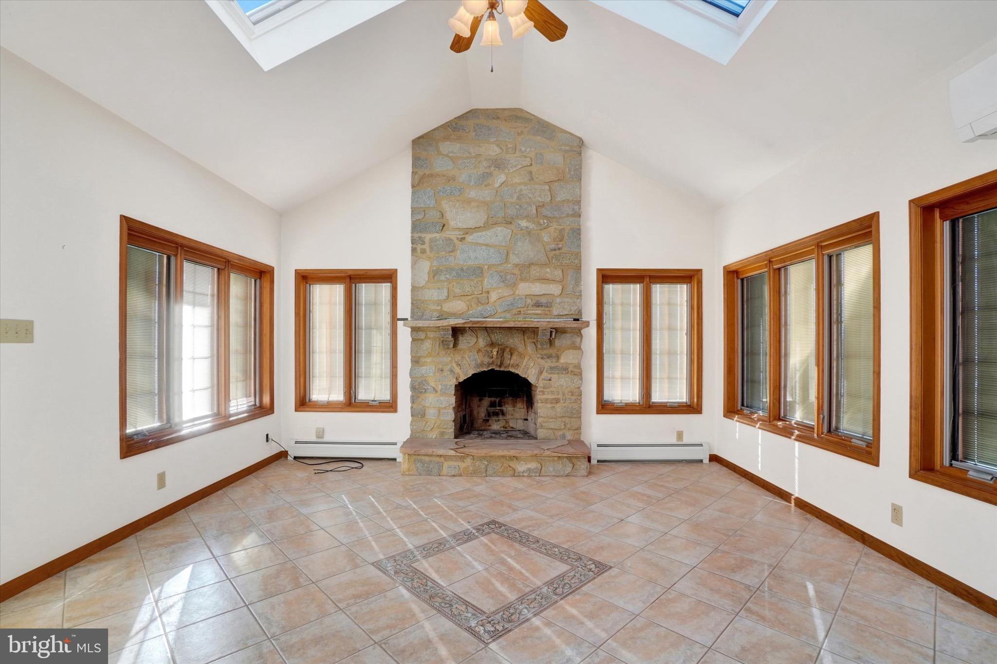 1100 Millcreek Road York, PA 17404 - Photo 5 of 44 a view of empty room with fireplace and windows