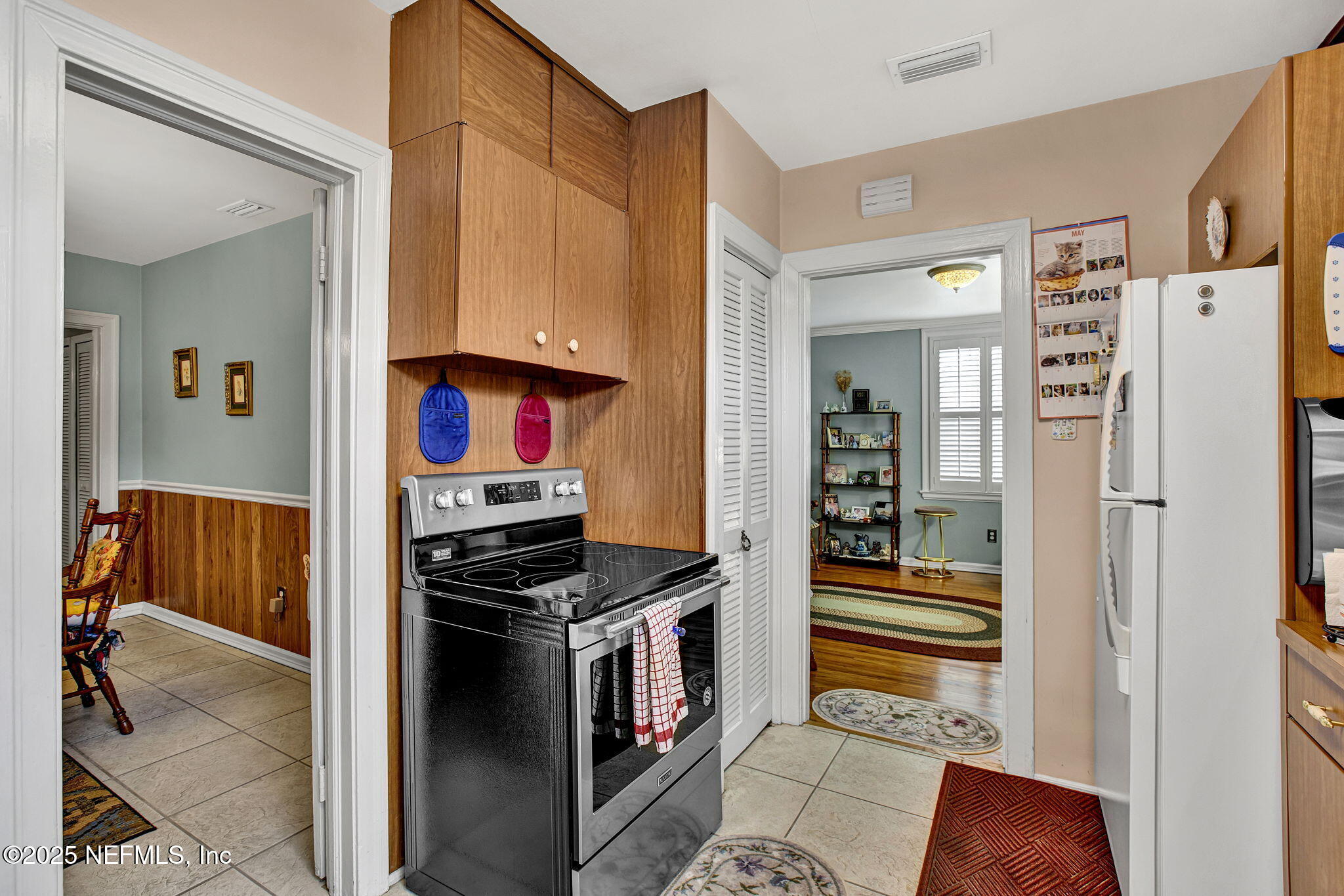 1105 South Shores Road Jacksonville, FL 32207 - Photo 14 of 31 a kitchen with stainless steel appliances a refrigerator and a stove top oven