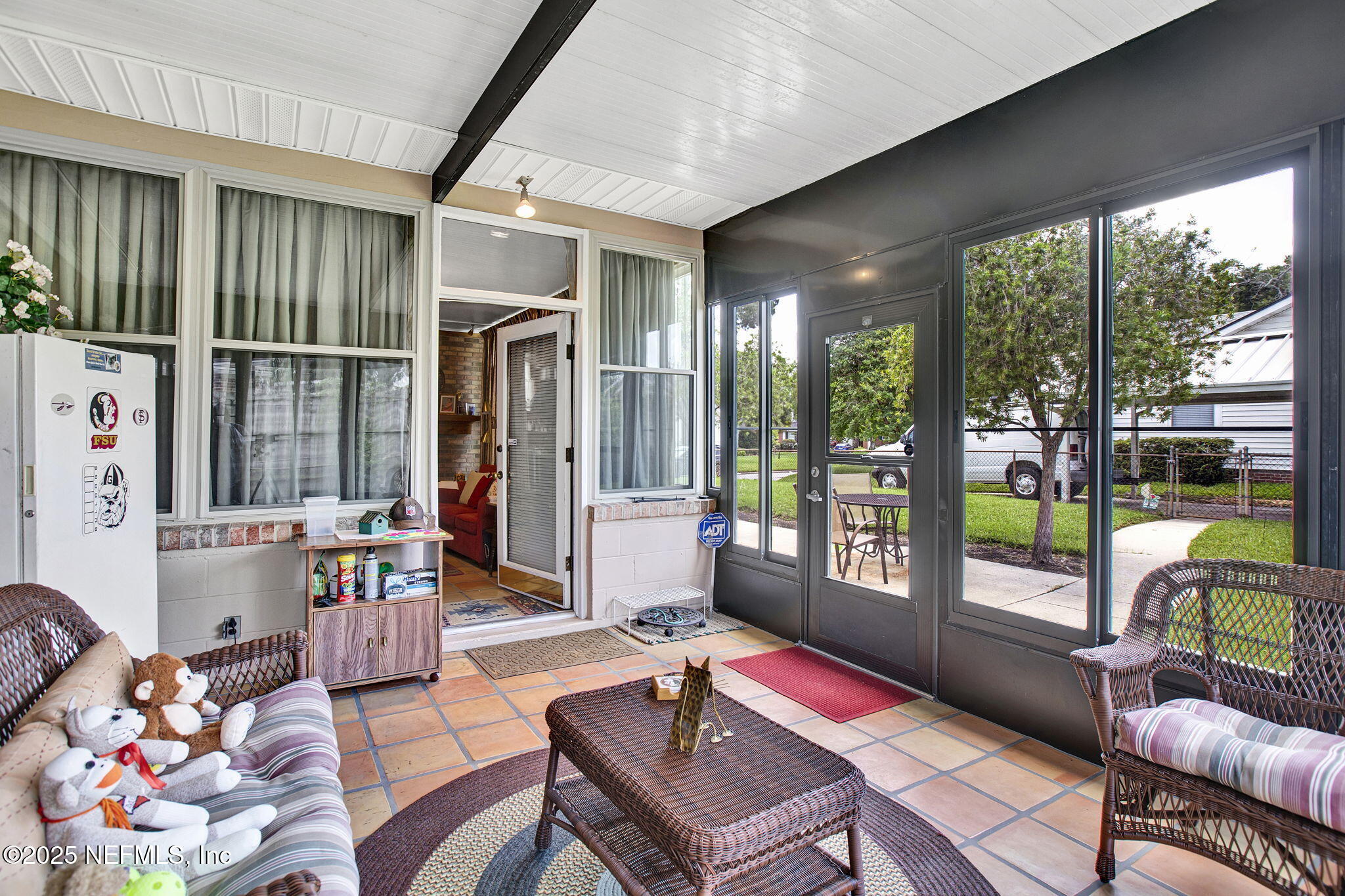 1105 South Shores Road Jacksonville, FL 32207 - Photo 19 of 31 a living room with furniture and a floor to ceiling window