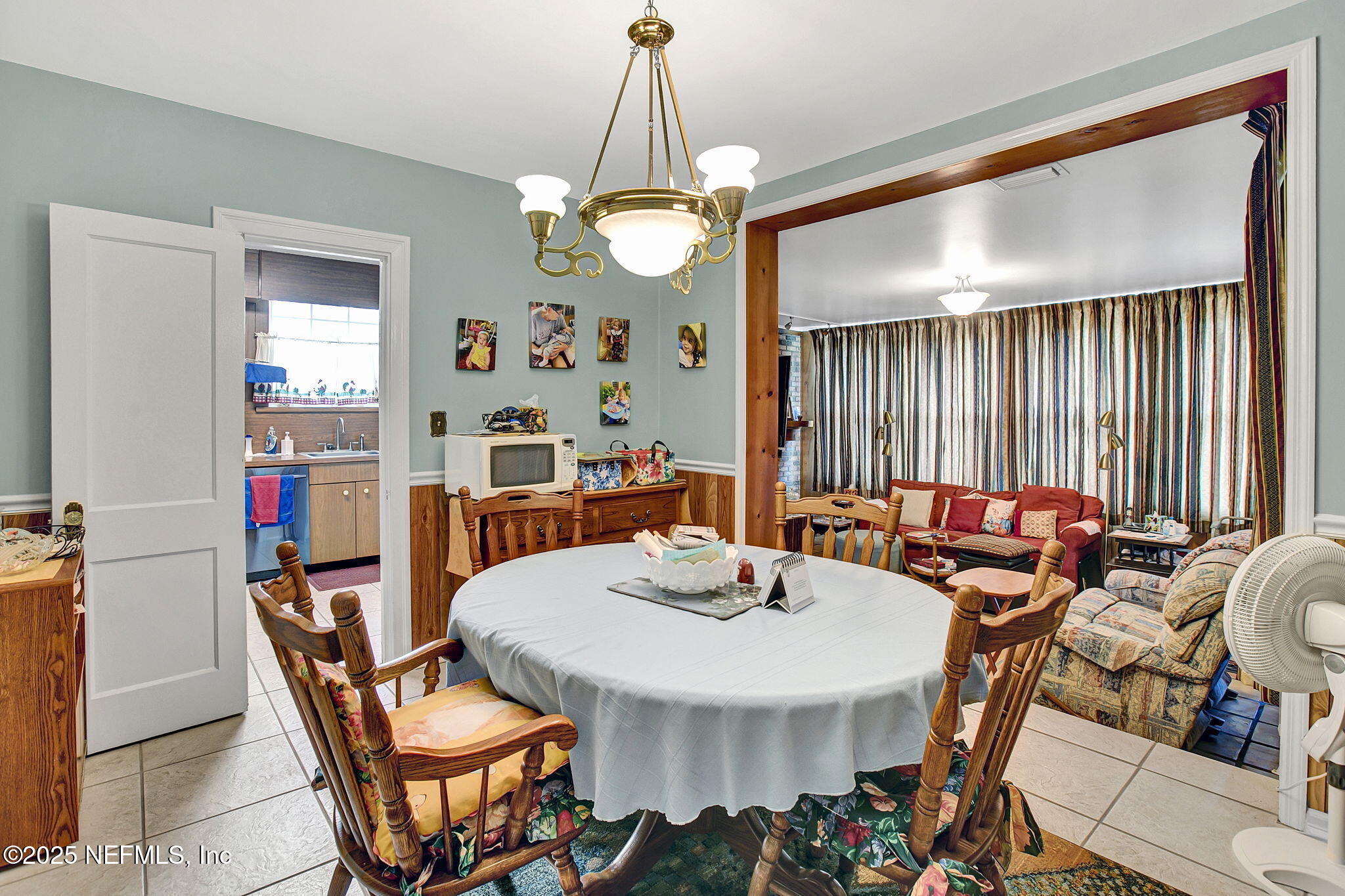 1105 South Shores Road Jacksonville, FL 32207 - Photo 24 of 31 a view of a dining room with furniture and chandelier