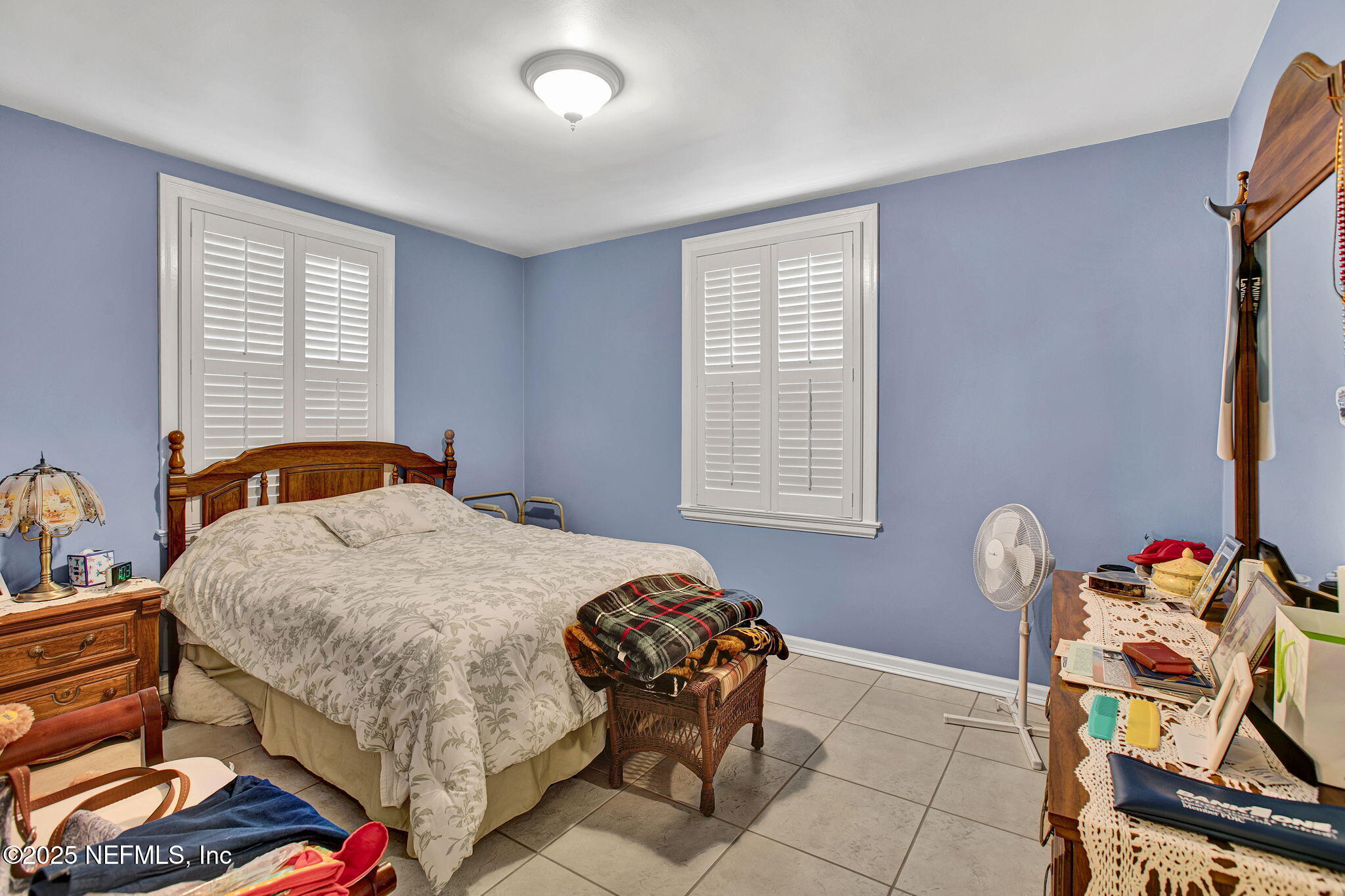 1105 South Shores Road Jacksonville, FL 32207 - Photo 26 of 31 a bedroom with a bed and a window