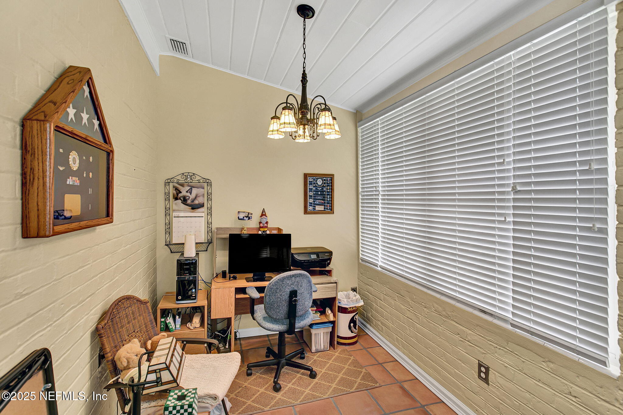 1105 South Shores Road Jacksonville, FL 32207 - Photo 7 of 31 a living room with furniture and a window
