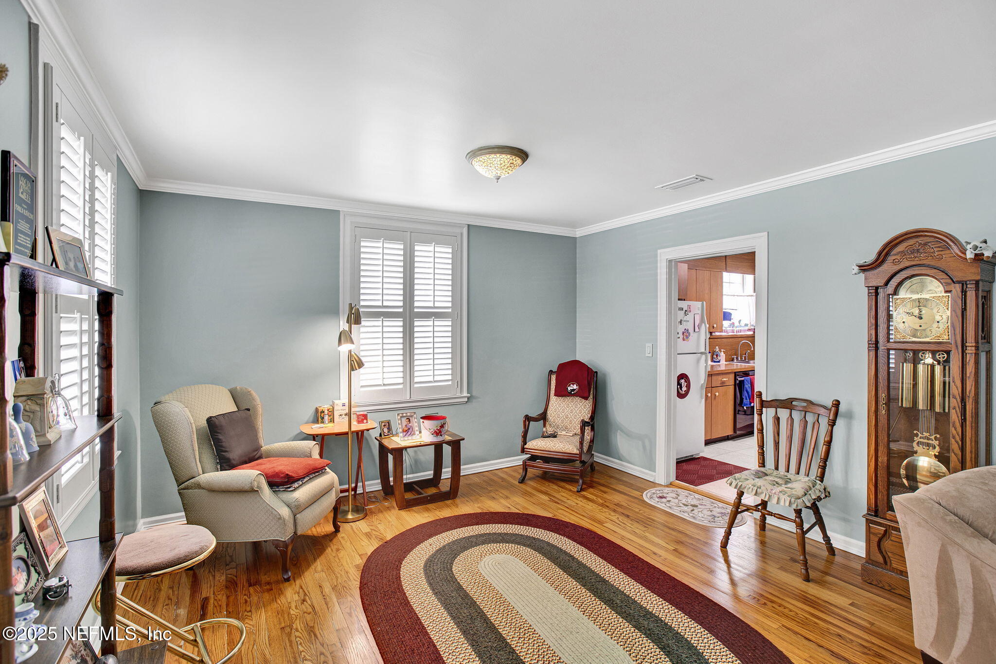 1105 South Shores Road Jacksonville, FL 32207 - Photo 10 of 31 a living room with furniture and wooden floor