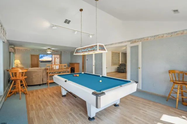 a kitchen with stainless steel appliances granite countertop a refrigerator sink and cabinets
