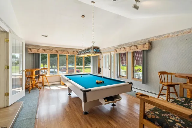 a kitchen with granite countertop a sink stainless steel appliances and cabinets