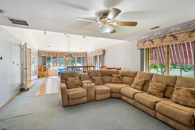 a kitchen with granite countertop a sink and a refrigerator