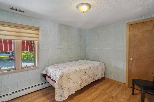 a utility room with cabinets and washer