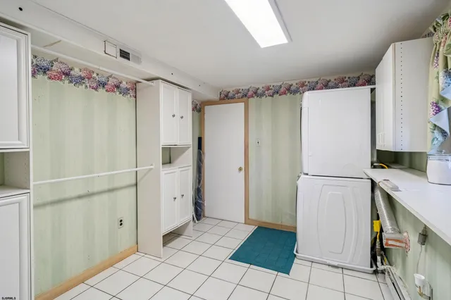 a view of a room with wooden ceiling
