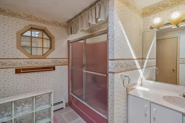 a view of a house with a yard table and chairs