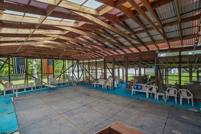 an aerial view of a house with garden space and lake view