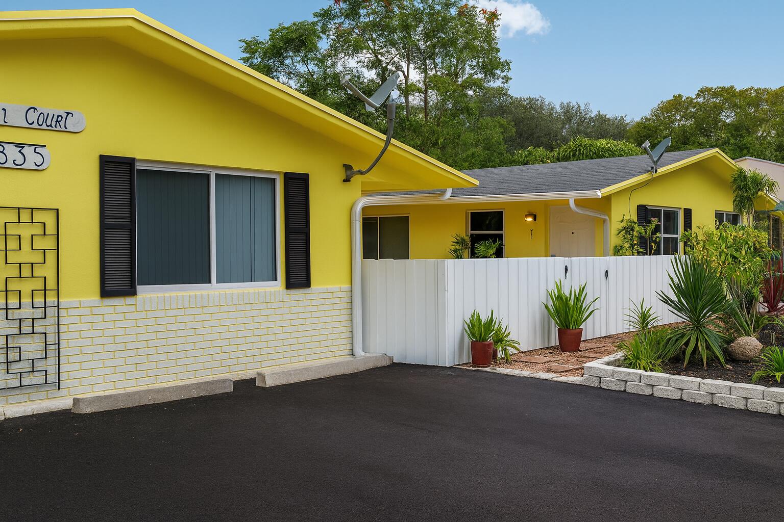 635 Southwest 14th Terrace, Unit 19 Fort Lauderdale, FL 33312 - Photo 1 of 8 a front view of a house with yard