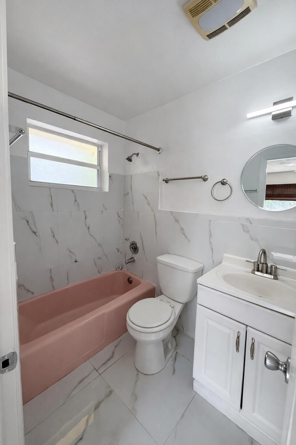 635 Southwest 14th Terrace, Unit 19 Fort Lauderdale, FL 33312 - Photo 4 of 8 a bathroom with a sink a toilet and a bathtub